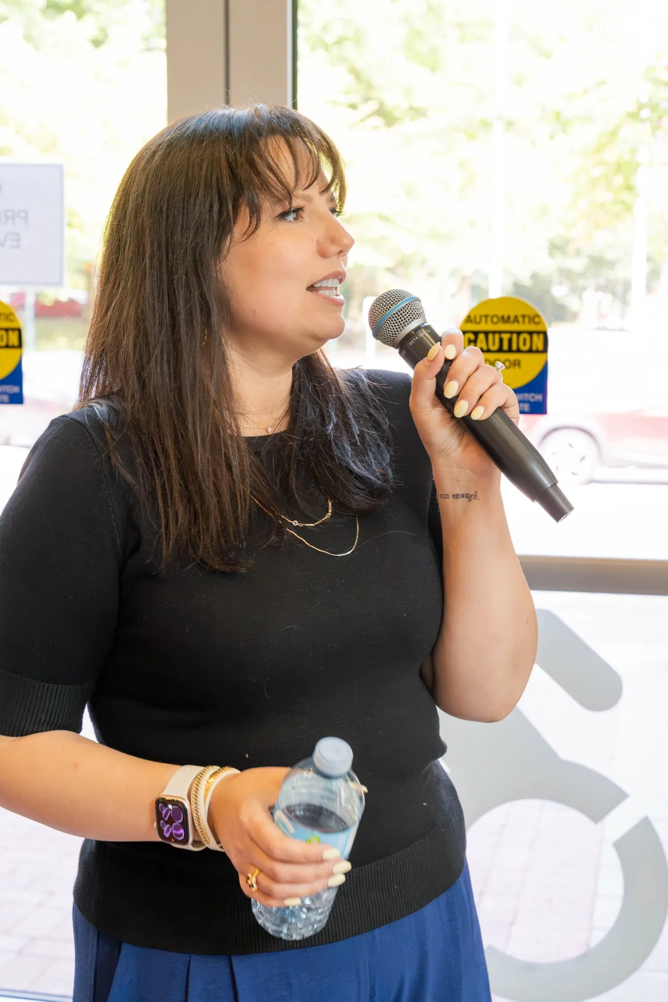 Brooke talking into the microphone at the launch
